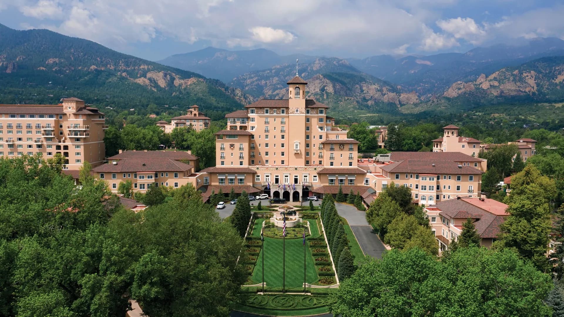 Aerial view of The Broadmoor resort and its formal gardens against the Colorado Springs foothills